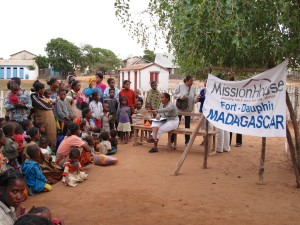 Doctor telling mothers how they will receive the rice, corn and oil