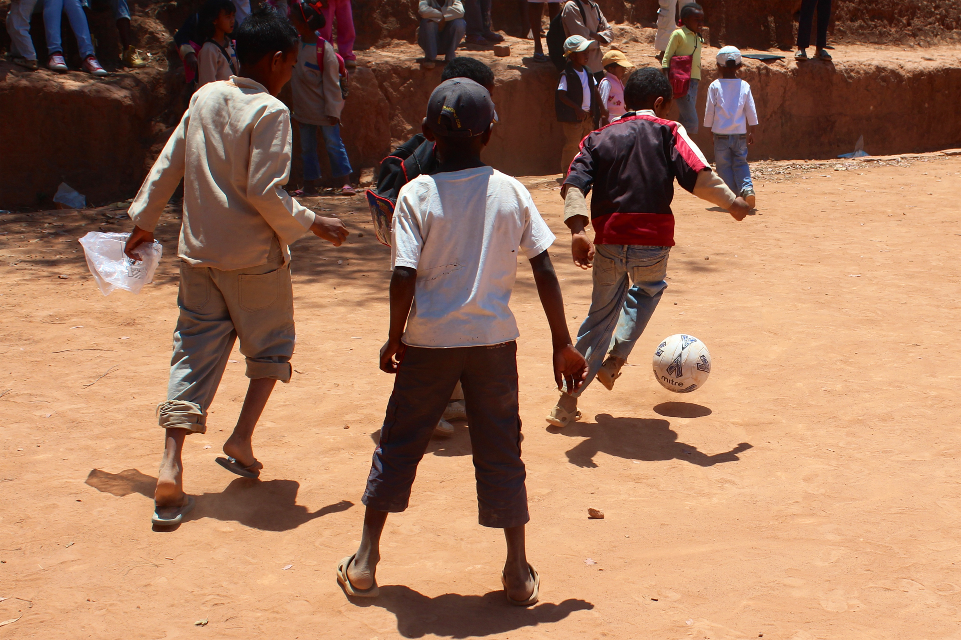 Group of children playing football in the Ambondrona School, Madagascar