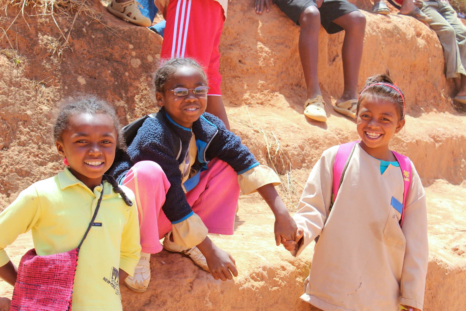 Group of three girls smiling at the Ambondrona School, Madagascar