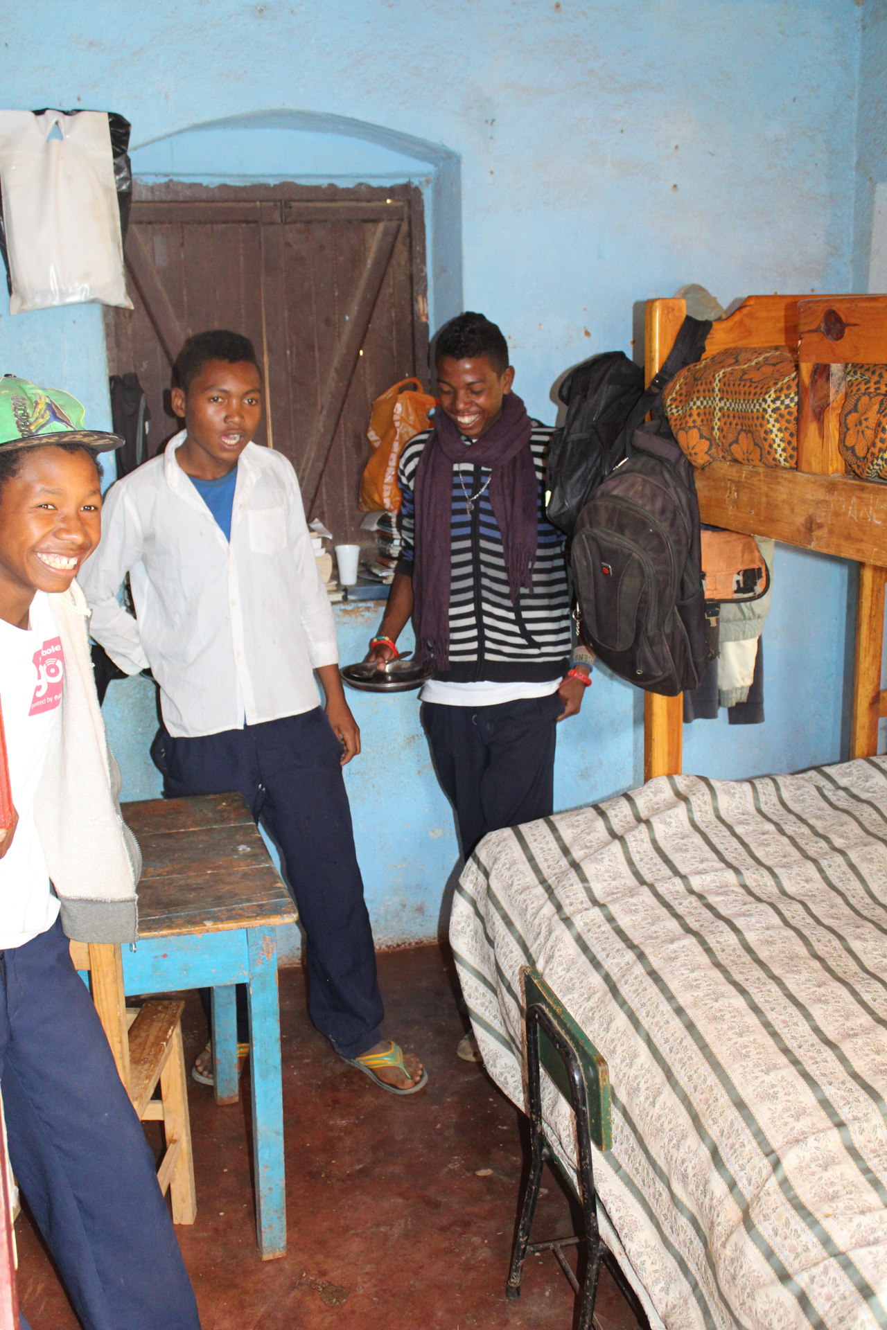 Group of three teen boys in Le Triomphe Children's orphanage in Madagascar